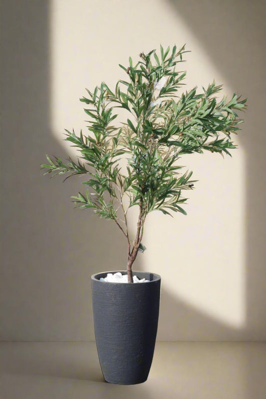 עץ זית מלאכותי + כד שחור מעוצב + חלוקי נחל